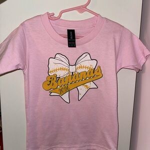 Gildan Pink Banana Ball 2026 Bow Kids T-Shirt